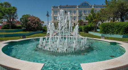 Public fountain in the center of the Cattolica squareの写真素材