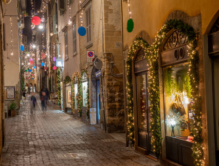 Ancient city street illuminated with Christmas decorationsの写真素材