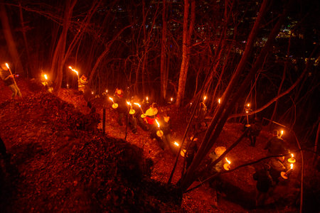 Serina Italy December 24 2024: Torchlight procession awaiting Christmas in the mountains of Val Serinaの写真素材
