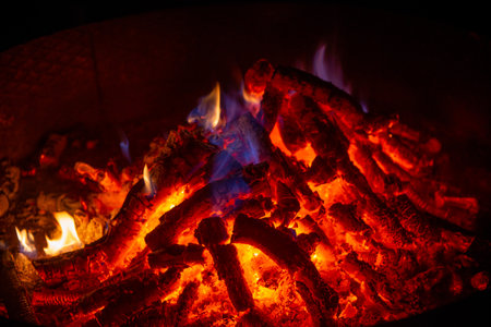 Brazier lit while wood is burning