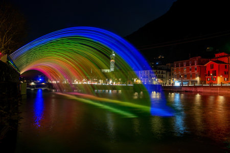 Illuminated water jets in rainbow colorsの写真素材