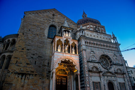 The Basilica of Santa Maria Maggiore in Bergamo illuminated at sunsetの写真素材