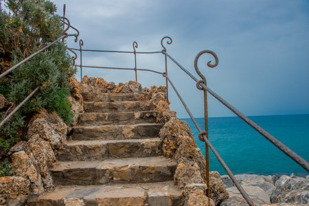 External stone staircase leading to the seaの写真素材