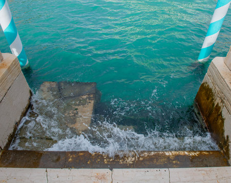 Venice Boat Docking with High Waterの写真素材