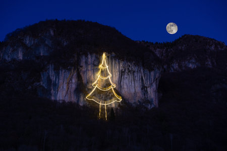 Cornalba cliff illuminated with Christmas treeの写真素材