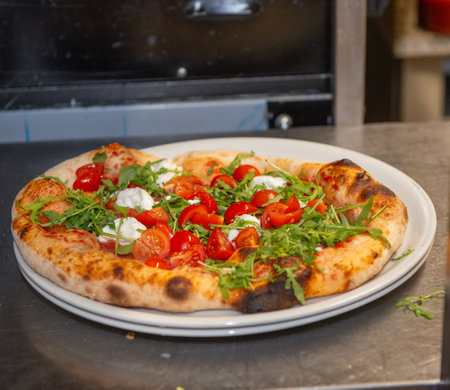 Pizza on the plate ready to be enjoyedの写真素材