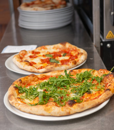 Pizza on the plate ready to be enjoyedの写真素材