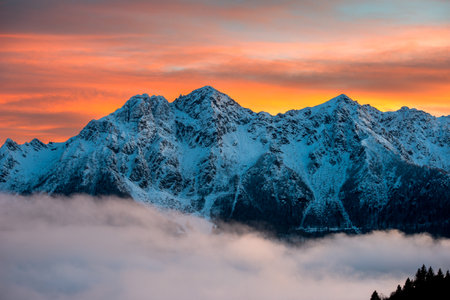 Snow-capped Orobie mountains at sunset