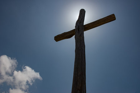 Wooden cross placed on the summit in memory of the fallen of the mountainの写真素材