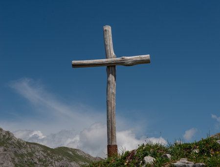 Wooden cross placed on the summit in memory of the fallen of the mountainの写真素材