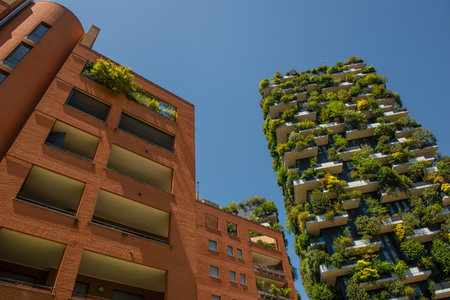 Milan Italy 28 June 2025: The Bosco Verticale is a complex of two residential buildings, with the presence of more than two thousand tree species, including shrubs and trees located on the terracesの写真素材