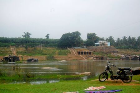 motorcycle parking on river, Hampi, Indiaの写真素材