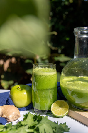 Healthy green smoothie with apple, celery, lemon and gingerの写真素材