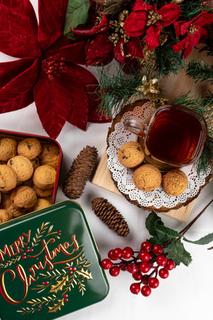 Christmas cake with cookies and cup of tea on a white background, top viewの写真素材
