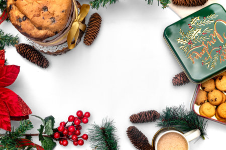 Christmas background with cookies, cup of coffee and christmas decorations on white table, top viewの写真素材