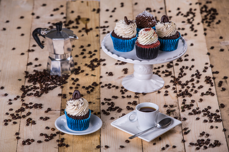 breakfast whit cupcake and coffee on the wooden backgroundの写真素材
