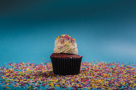 cupcacke whit cream on the blu backgroundの写真素材