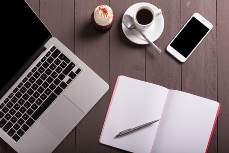 breakfast whit coffee and cupcake on the workの写真素材