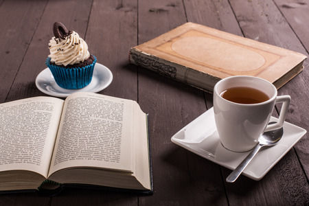 break study whit tea and cupcake on the tableの写真素材