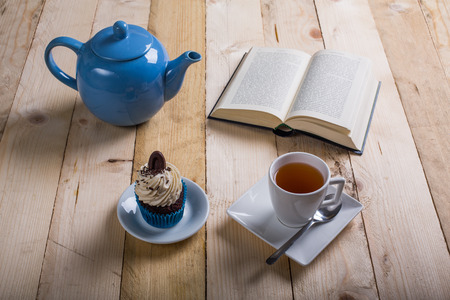 break study whit tea and cupcake on the tableの写真素材