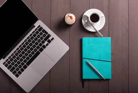 breakfast whit coffee and cupcake on the workの写真素材