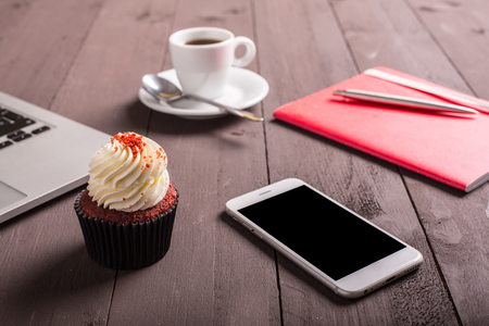 breakfast whit coffee and cupcake on the workの写真素材