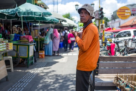 Yogyakarta, Indonesia - March 16, 2018: Elderly man on Malioboro Road in Yogyakarta.のeditorial素材