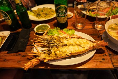 Koh Lipe, Thailand - February 20, 2019: Thai food with lobster on Koh Lipe in Thailand.のeditorial素材