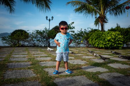 Langkawi, Malaysia - February 23, 2019: Chinese boy with sunglasses.のeditorial素材