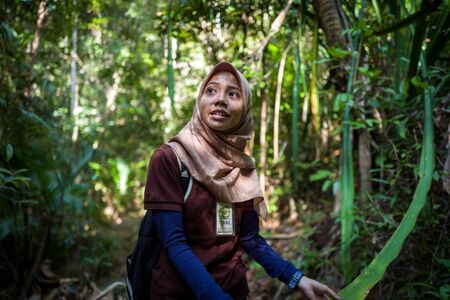 Langkawi, Malaysia - February 24, 2019: Local guide explaining the naturure surrounding the Sky Cab areaのeditorial素材