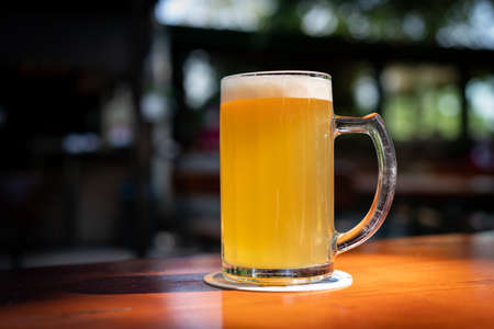 A glass of beer in the sun