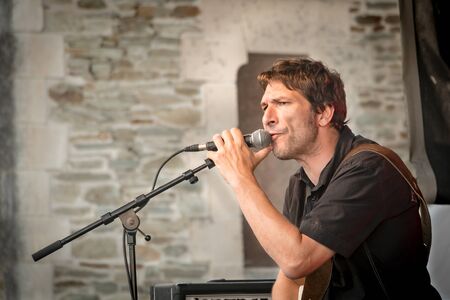 Saint-Gilles-Croix-de-Vie, France - July 07, 2016: Free outdoor concert Organized by the city for tourist for "Musicales du Pays de Saint-Gilles". Here plays the Chameleons group (The Chameleons).のeditorial素材