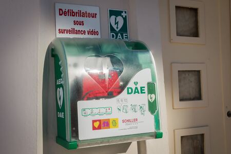 Sables-d-Olonnes, France - July 05, 2016 : AED - public automatic defibrillator on the bitch with french sign : "defibrillator with video control"のeditorial素材