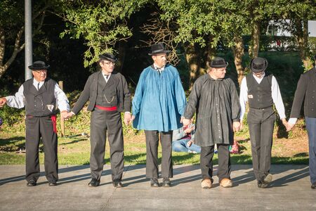 Brem sur Mer, France - July 09, 2016 : men dance in typical costume in a show of traditional dance troupe Vendee region of France, celebrating a weddingのeditorial素材