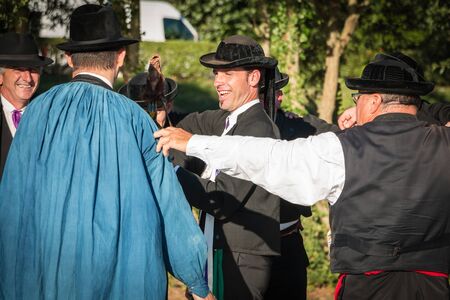 Brem sur Mer, France - July 09, 2016 : men dance round in a show of traditional dance troupe Vendee region of France, celebrating a weddingのeditorial素材