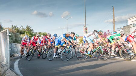 Saint Hilaire de Riez, France - August 10, 2016 : competitors in a night bike race, the 35th Trophy Louis Caiveau - professional cyclist in a corner at full speedのeditorial素材