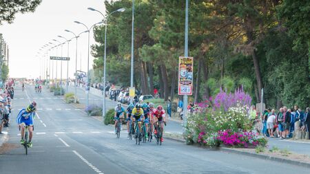 Saint Hilaire de Riez, France - August 10, 2016 : competitors in a night bike race, the 35th Trophy Louis Caiveau - professional cycling peloton during a night raceのeditorial素材