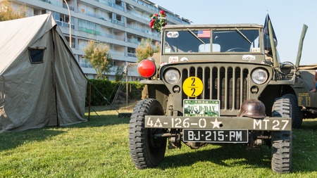 Les Sables d'Olonne, France - August 26, 2016 : commemoration of the Liberation of "Les Sables d'Olonne", which took place on the night of August 27 to 28, 1944 - old military jeep with his equipment exhibitionのeditorial素材