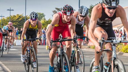 Saint Gilles Croix de Vie, France - September 10, 2016 : Final triathlon championship of France in the category D3 - cyclists in acceleration during a road bike raceのeditorial素材