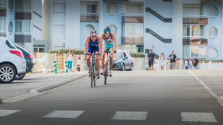 Saint Gilles Croix de Vie, France - September 10, 2016 : Final triathlon championship of France in the category D3 - cyclists straight for a road bike raceのeditorial素材
