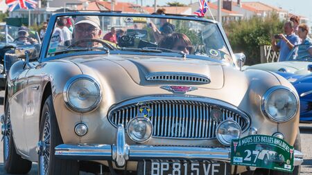 Sables d Olonne, France  - September 23, 2016 : English vintage car rally in the streets of the...