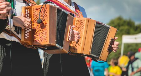 Accordion player on stage in a popular dance