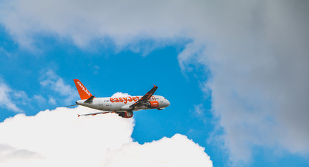 Nantes, FRANCE - April 27, 2017 ; Airbus A320-214 of EasyJet registered HB-JXC flying above Nantes...
