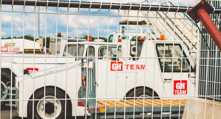 Nantes, FRANCE - April 27, 2017 ; Baggage tractors of the GH TEAM, an international company specializing in the help and logistics of airlines in airportsのeditorial素材