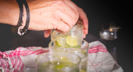 bartender mixes a Brazilian caipirinha with a spoon on a clothの写真素材