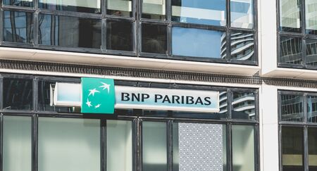 Nanterre, FRANCE, May 09, 2017 - Close-up on the sign of an agency of "BNP PARIBAS" a French international business bank whose headquarters is in the defense, the business district of Paris, Franceのeditorial素材