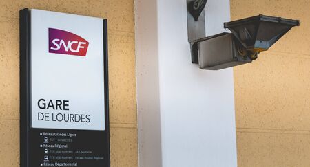 Lourdes, FRANCE, June 22, 2017 - Close-up on the sign of the SNCF station of Lourdes, France