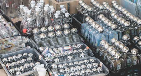 Lourdes, FRANCE, June 22, 2017 - Small bottles to take holy water from the grotto for sale near the sanctuary of Lourdes, Franceのeditorial素材