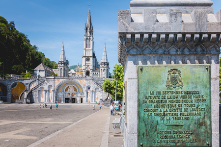 Lourdes, FRANCE, June 22, 2017 - tourists walking in front of the cathedral of the sanctuary of Lourdes, Franceのeditorial素材