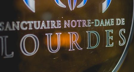 Lourdes, FRANCE, June 22, 2017 - Close-up on machines allowing tourists to buy medals souvenirs from the sanctuary of Lourdes, Franceのeditorial素材